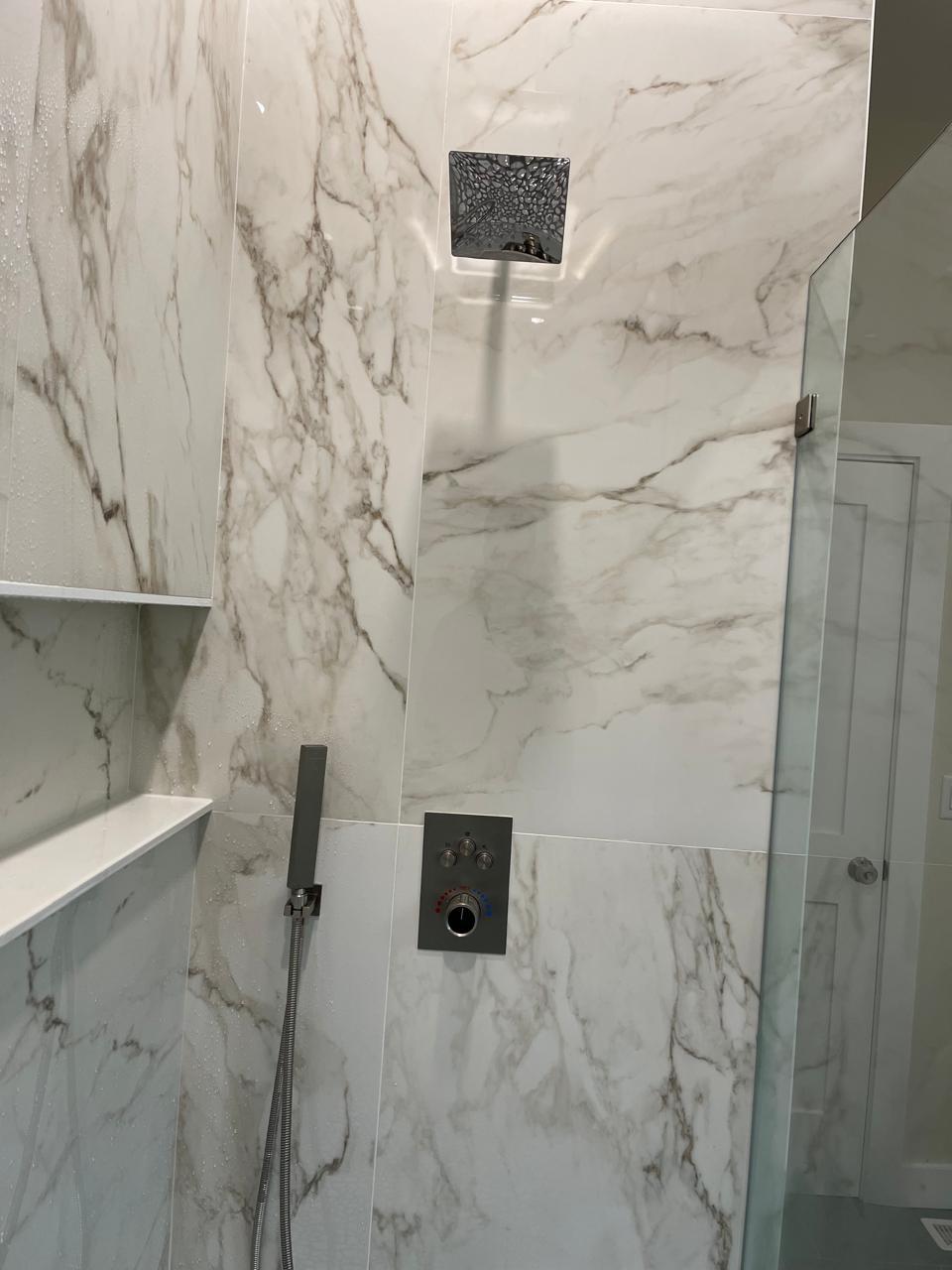 Shower head, handshower and valve finished installation in bathroom