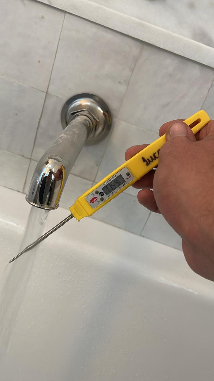 Finished bathroom with temperature control valve installation
