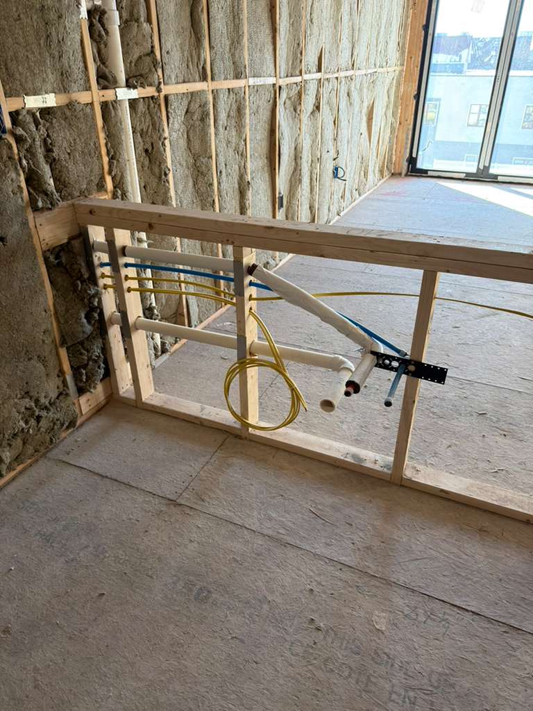Kitchen island sink rough plumbing installation - water and drain lines